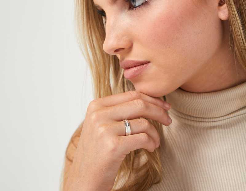 The Outer Wave Ring in Sterling Silver on a female