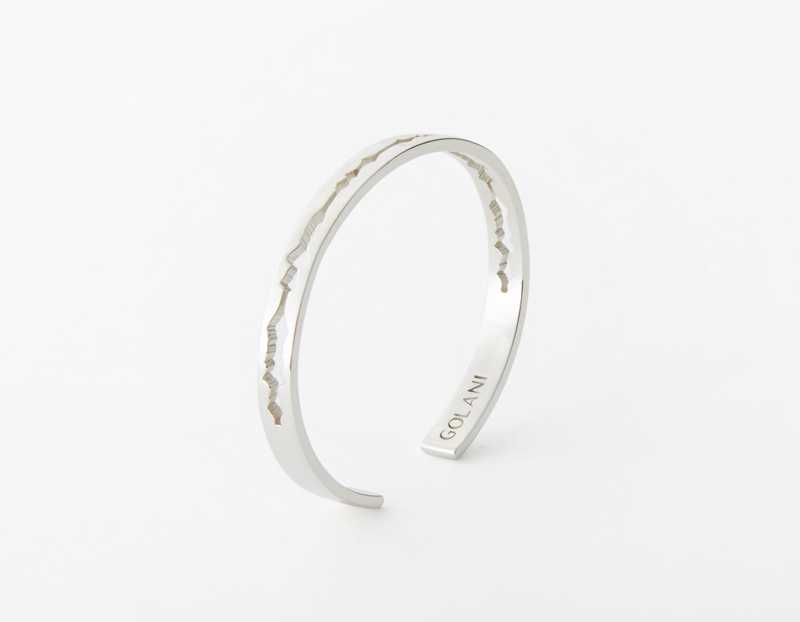 The Cut Wave Bracelet placed vertical in Sterling Silver