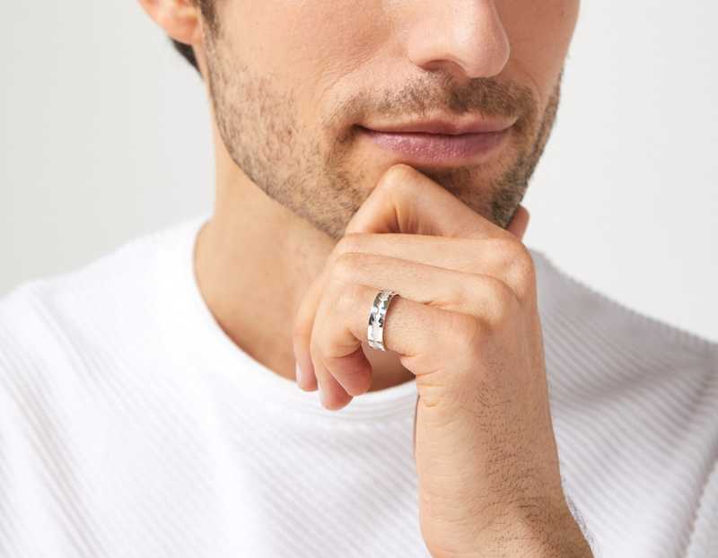 The Outer Wave Ring in Sterling Silver on a male