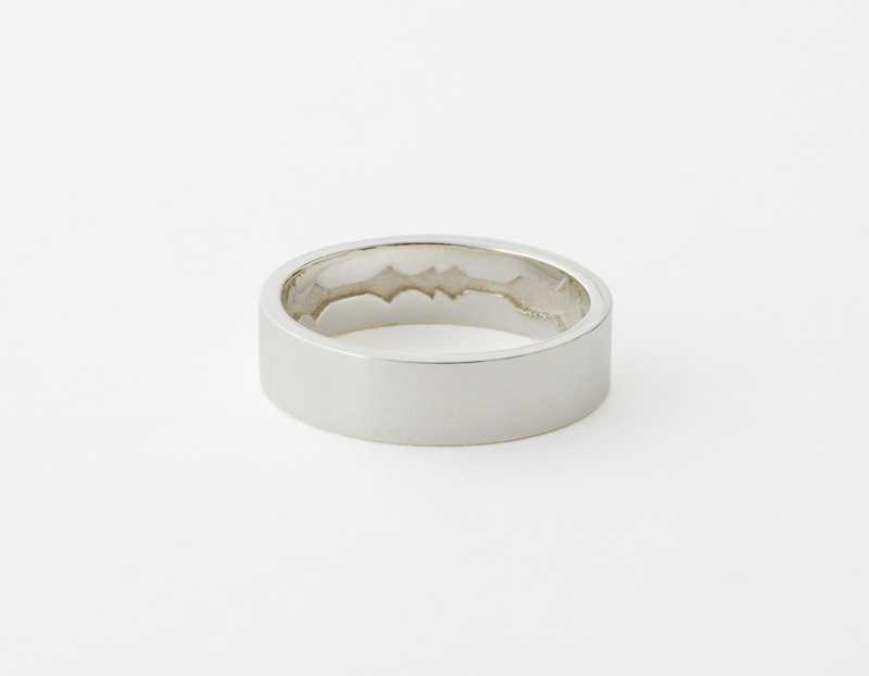 The Inner Wave Ring placed horizontal in Sterling Silver