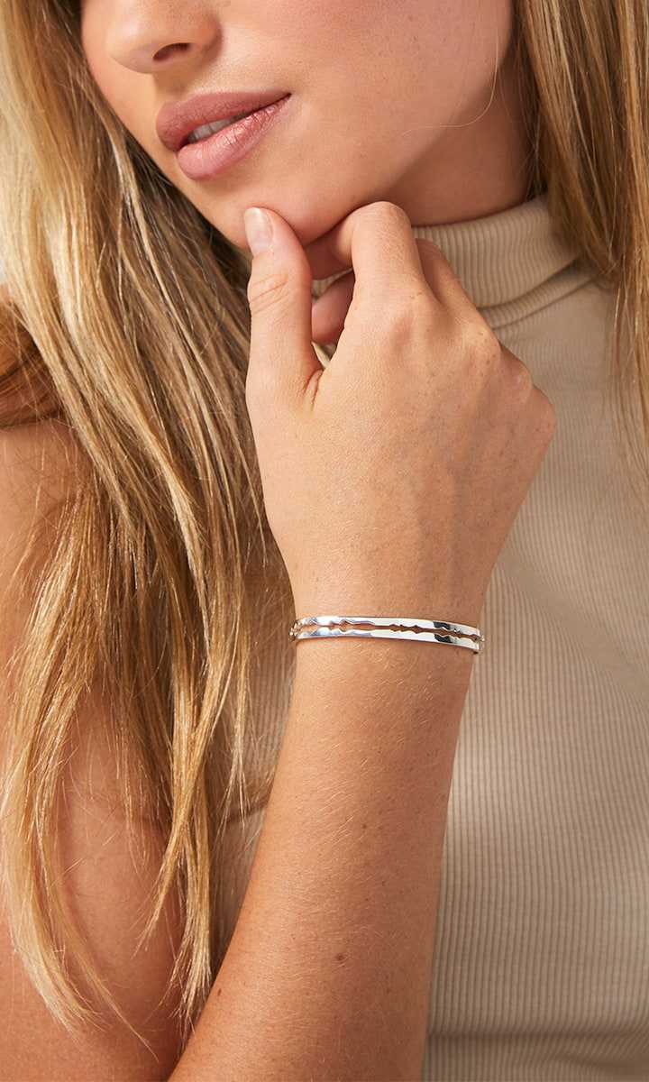 Sterling silver cut sound wave bracelet on female